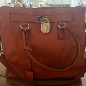 Gorgeous Michael Kors bag. Gol detail - buckle, locks and chain strap. Like new!